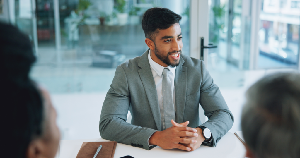 Two men in business suits having a conversation.